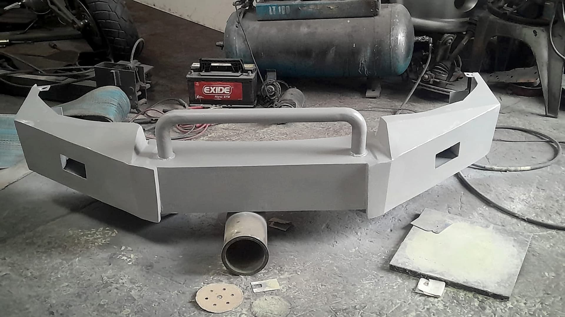 Custom-fabricated steel bull bar, primed and ready for coating